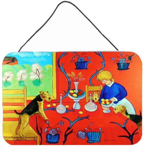 Airedale Terrier with lady in the kitchen Wall or Door Hanging Prints by Caroline's Treasures