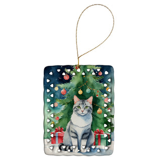 Caroline's Treasures Aegean Cat By the Christmas Tree Porcelain Ornament