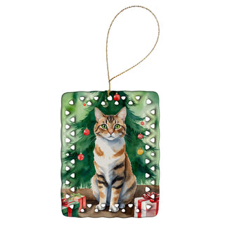 Caroline's Treasures Owyhee Bob Cat By the Christmas Tree Porcelain Ornament
