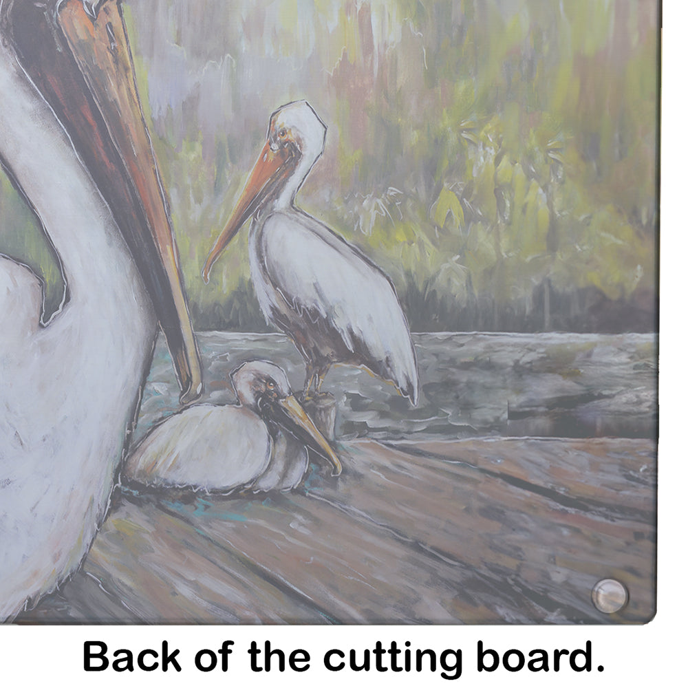 Three Pelicans on a Pier Glass Cutting Board
