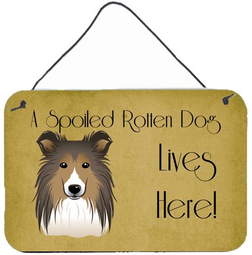Sheltie Spoiled Dog Lives Here Wall or Door Hanging Prints BB1490DS812 by Caroline&#39;s Treasures