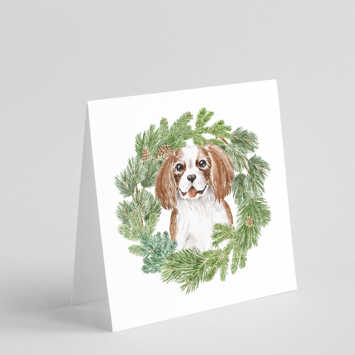 Buy this Cavalier King Charles Spaniel Blenheim Puppy Smiling with Christmas Wreath Square Greeting Cards and Envelopes Pack of 8