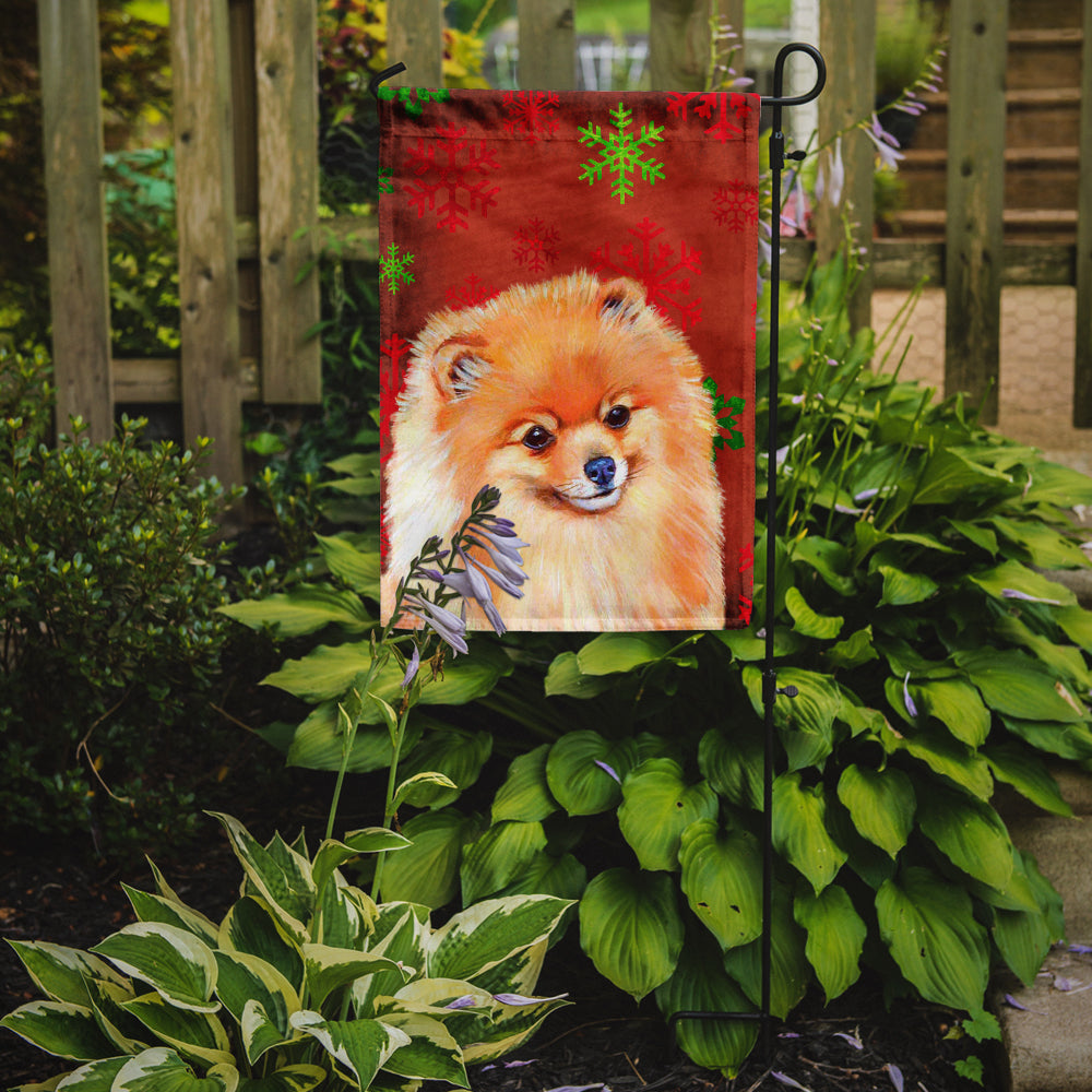 Pomeranian Red and Green Snowflakes Holiday Christmas Flag Garden Size.