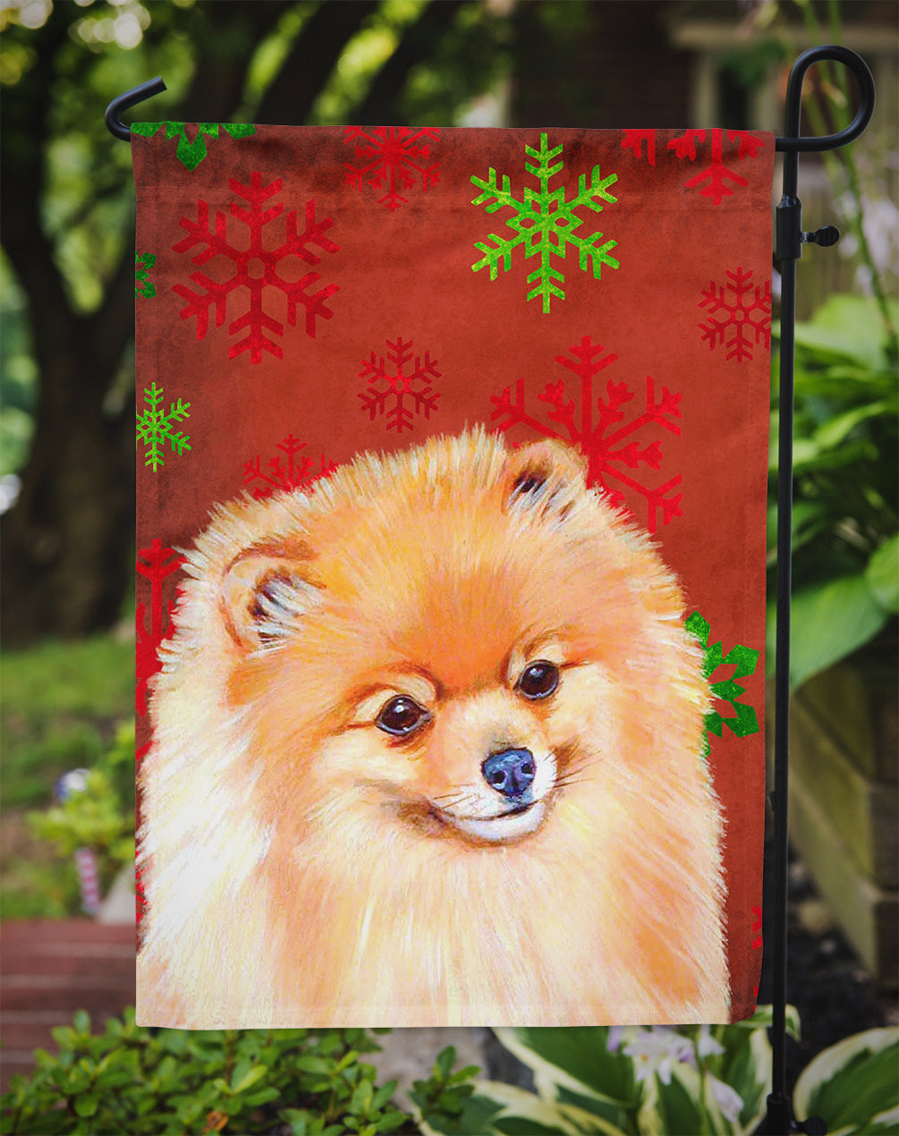 Pomeranian Red and Green Snowflakes Holiday Christmas Flag Garden Size.