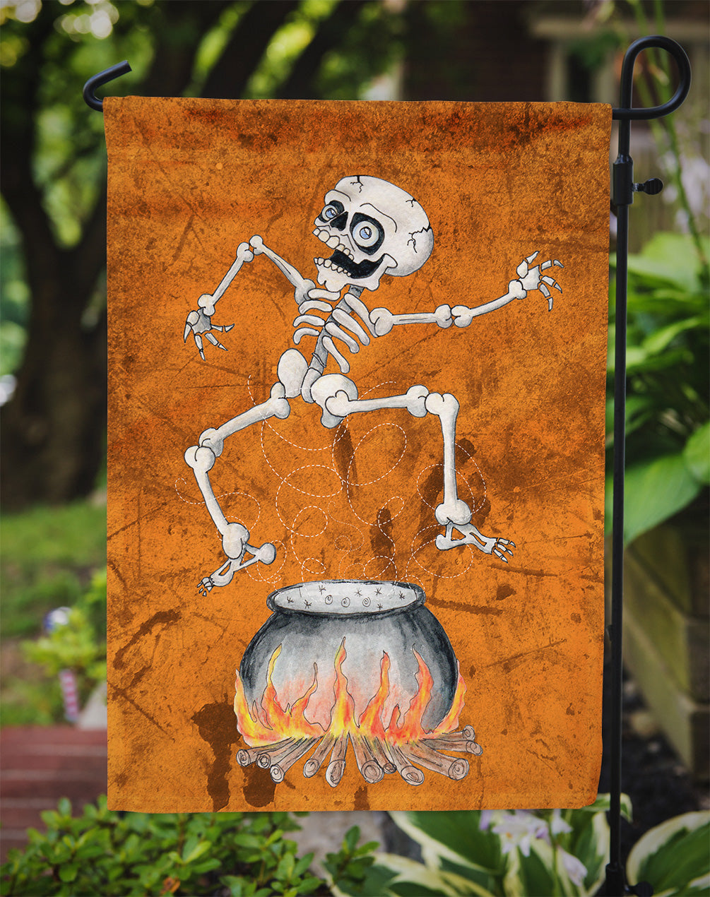 Skeleton jumping from Witches Caldron Halloween Flag Garden Size.