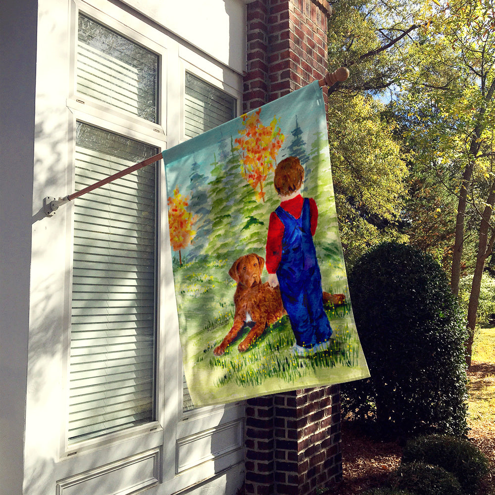 Little boy with his Chesapeake Bay Retriever Flag Canvas House Size  the-store.com.